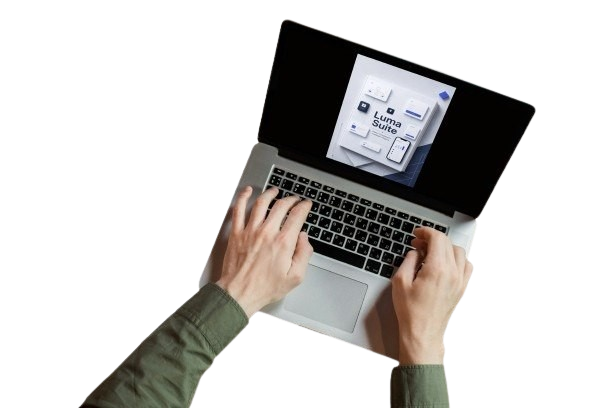 Person using a laptop with a screen displaying a software interface on a white background